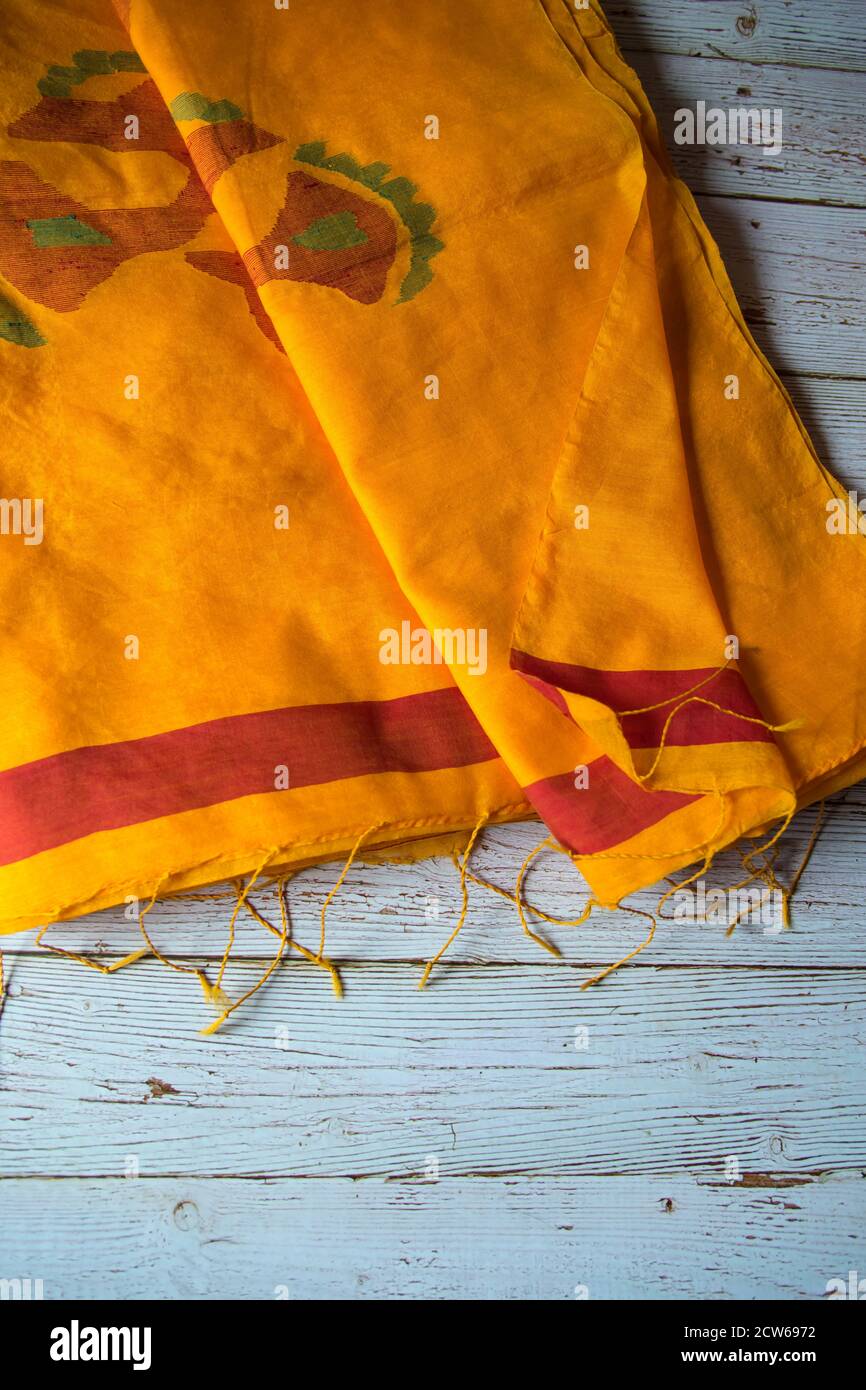 Top view of yellow cotton sari on a background Stock Photo