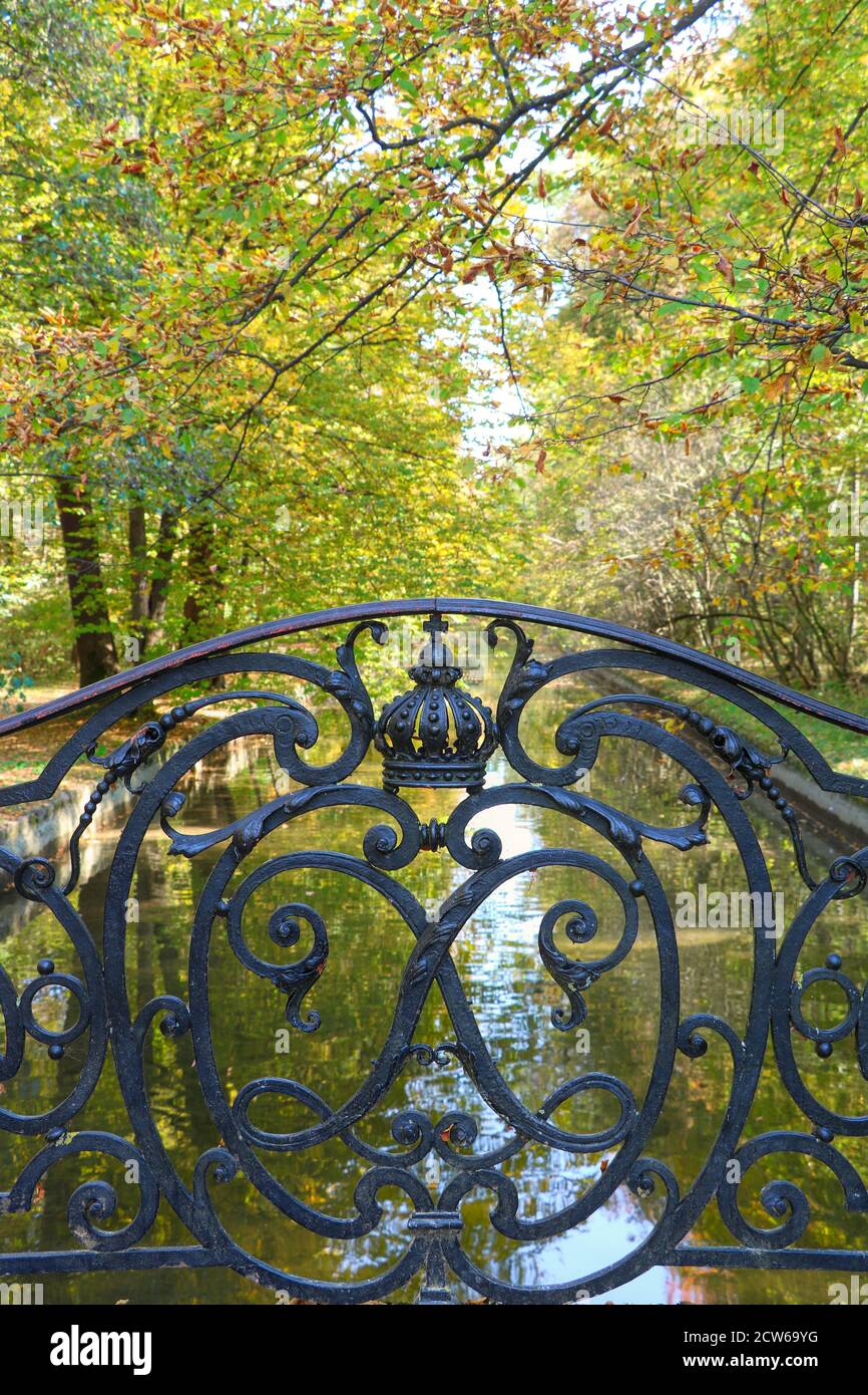 autumn landscape with bridge in Nymphenburg park Munich Germany Stock Photo