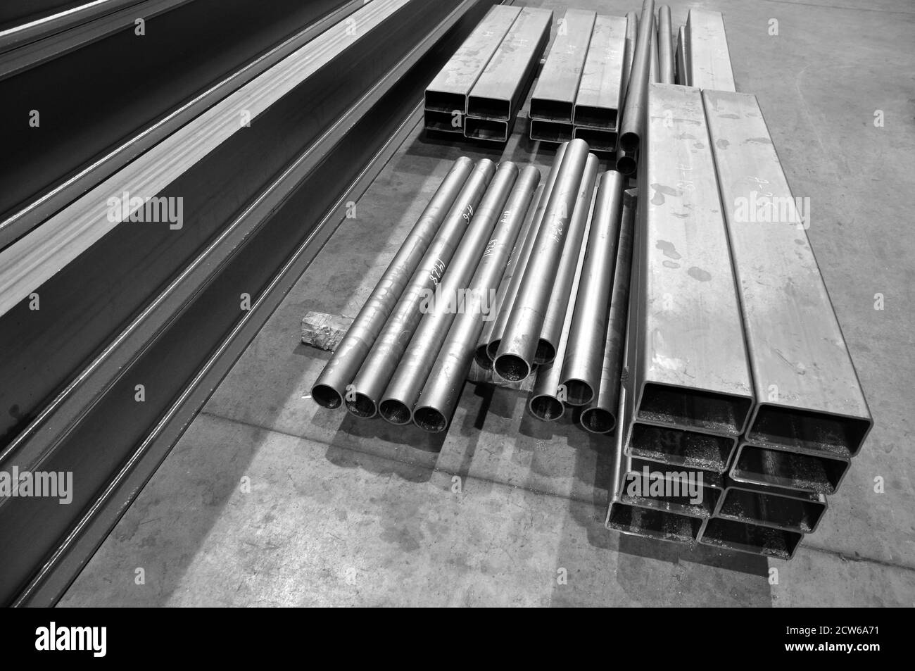 Steel pipe at a metalwork plant. Blanks for the manufacture of structures in the workshop. Stock Photo