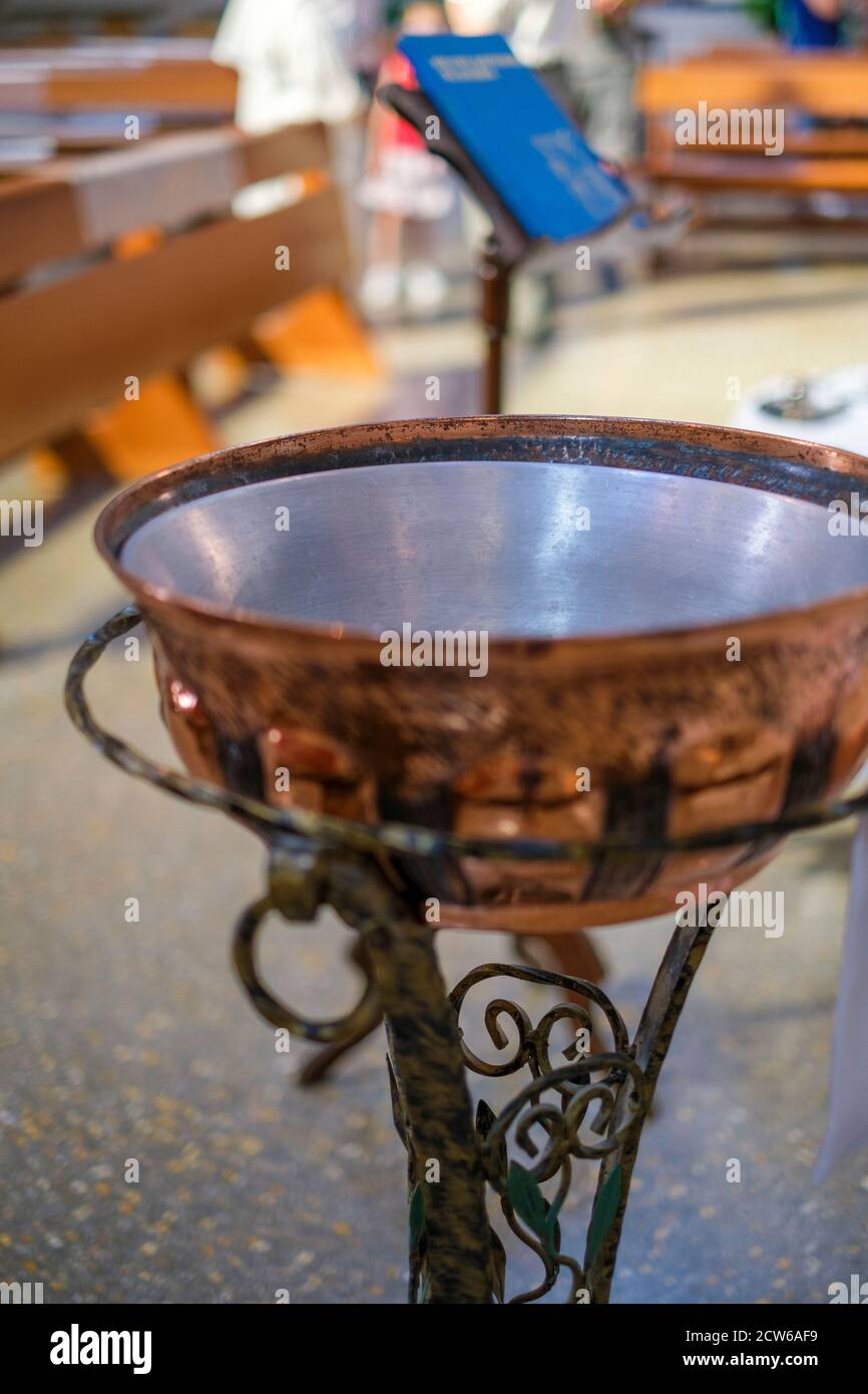 baptismal font in catholic church in italy for baptism in copper on