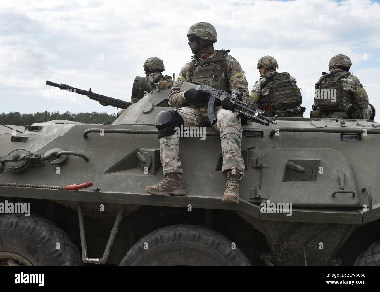 Soldiers with machine guns on an armored personnel carrier. Post-Soviet conflicts. Caucasus war Stock Photo