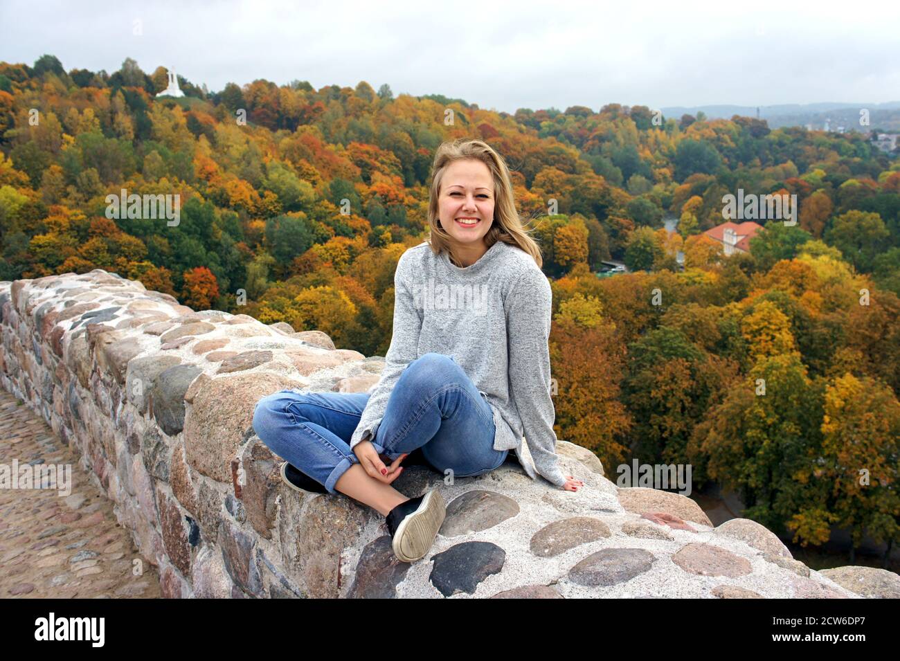 Young girl having a walk in Autumn forest. Beautiful park with dry ...