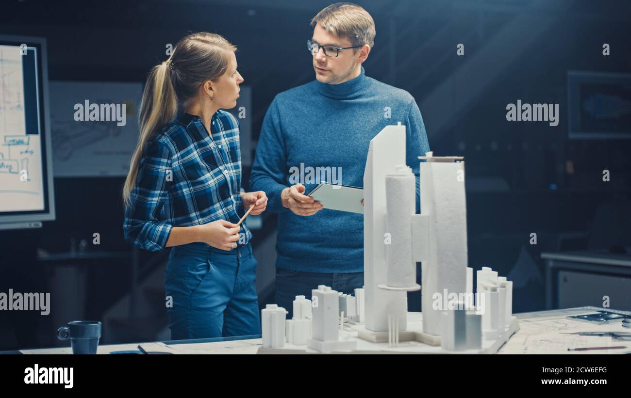 In the Creative Architectural Bureau Two Professional Engineers Work on ...