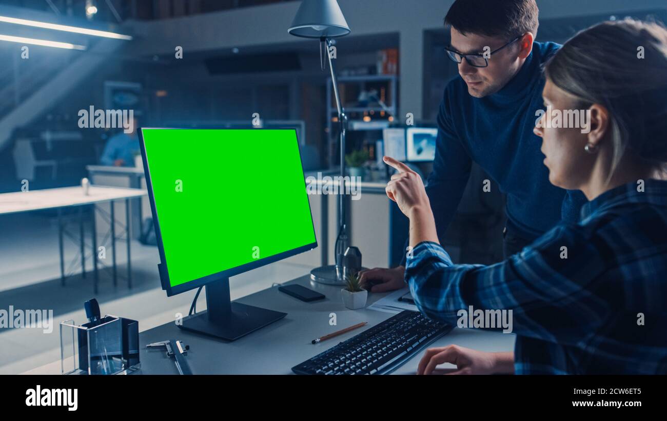Engineer Working on Desktop Computer, Screen Showing CAD Software with ...