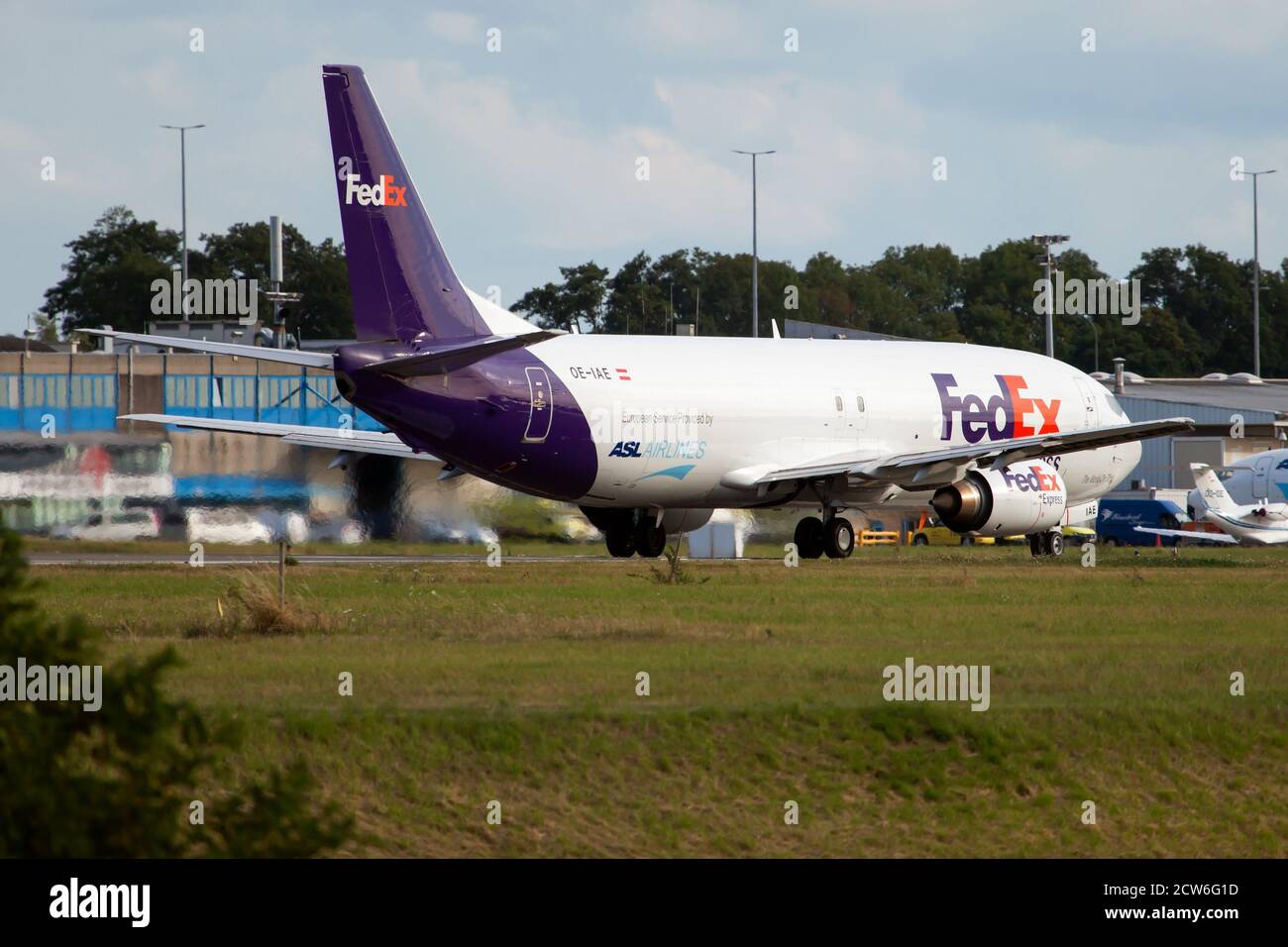 A FedEx Boeing 737-400Sf about to leave a Liege Bierset airport full of packs to deliver. Stock Photo