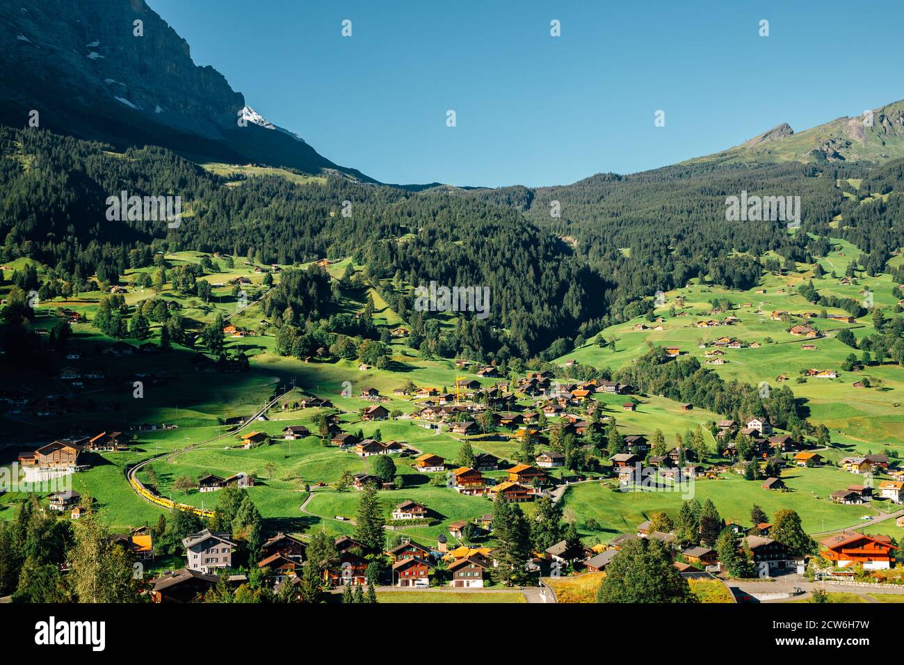 Panoramic view of Grindelwald village. mountain and wooden houses in ...