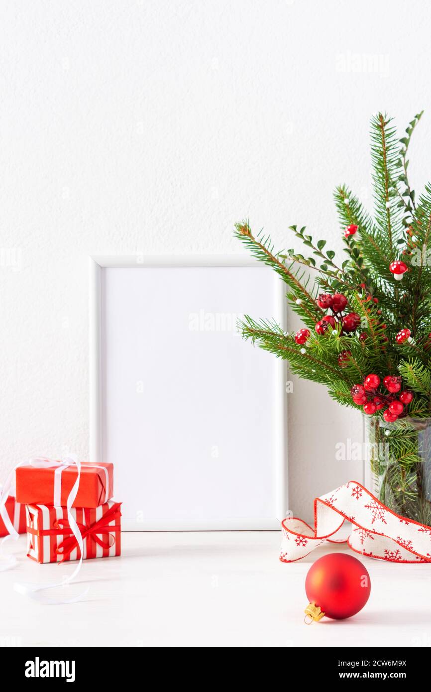 Christmas poster mock up with vertical frame, fir tree branches and ...