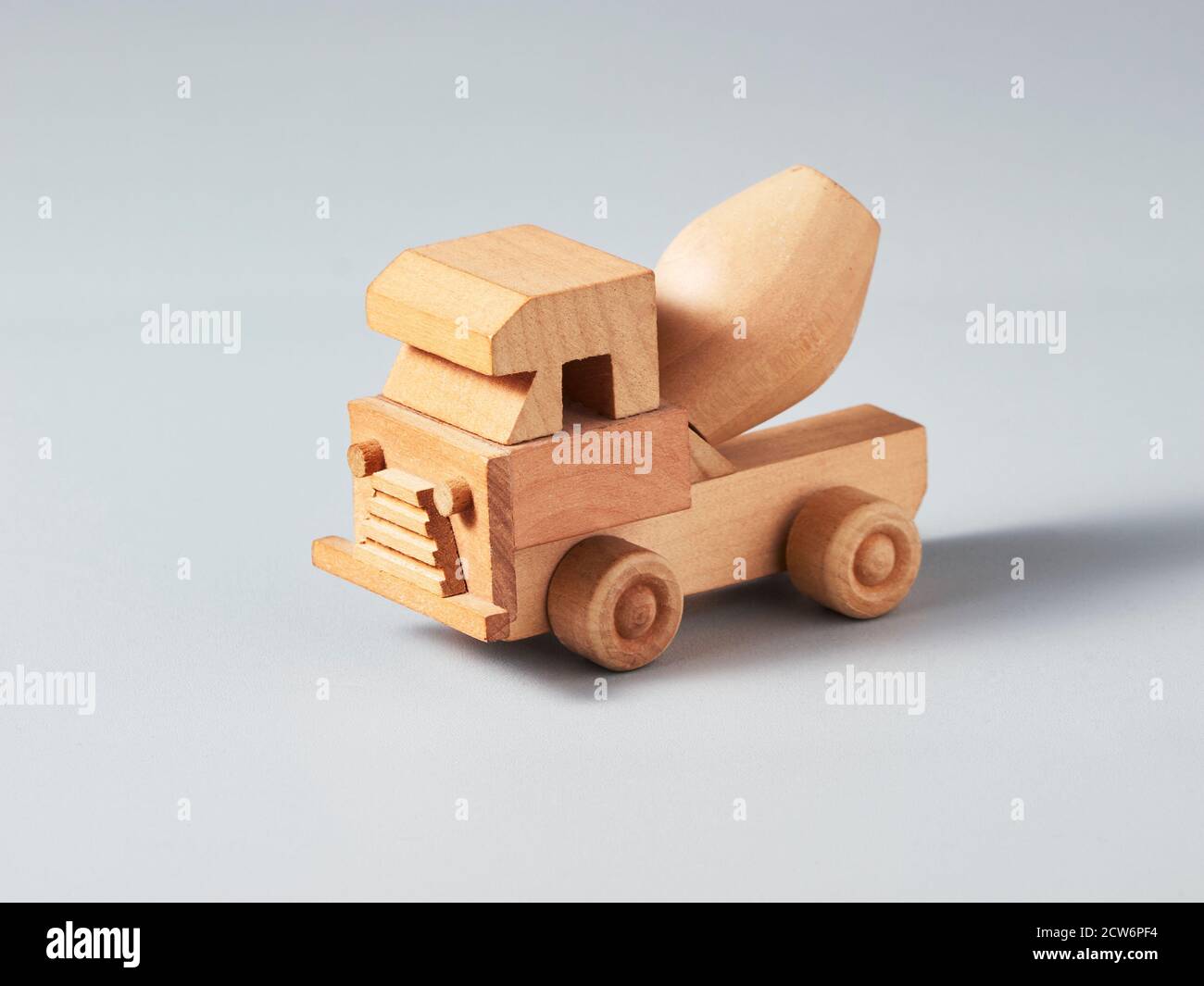 Wooden mixer truck toy on grey background Stock Photo