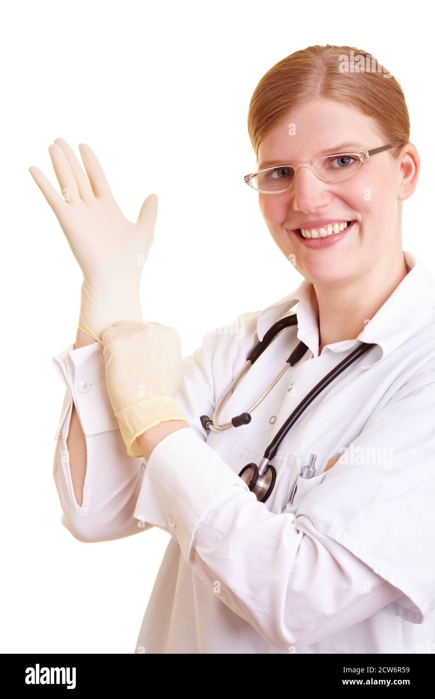 Blonde doctor puts on rubber gloves Stock Photo Alamy