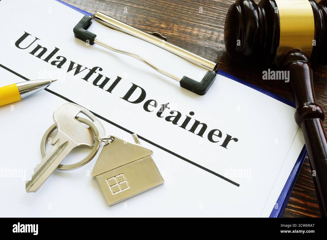 Unlawful detainer papers, key and gavel in the court. Stock Photo
