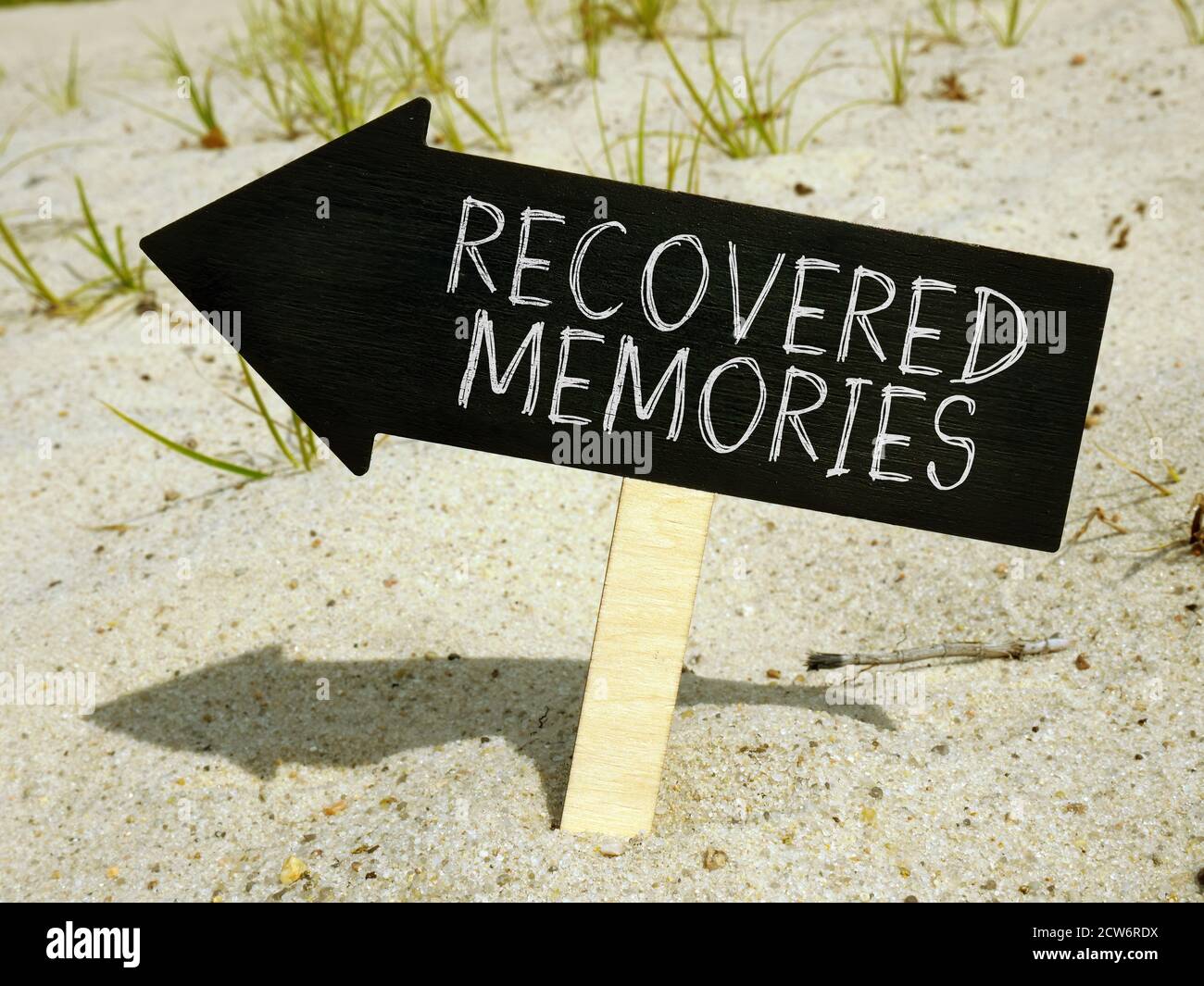 Recovered memories inscription on the black arrow showing the direction. Stock Photo