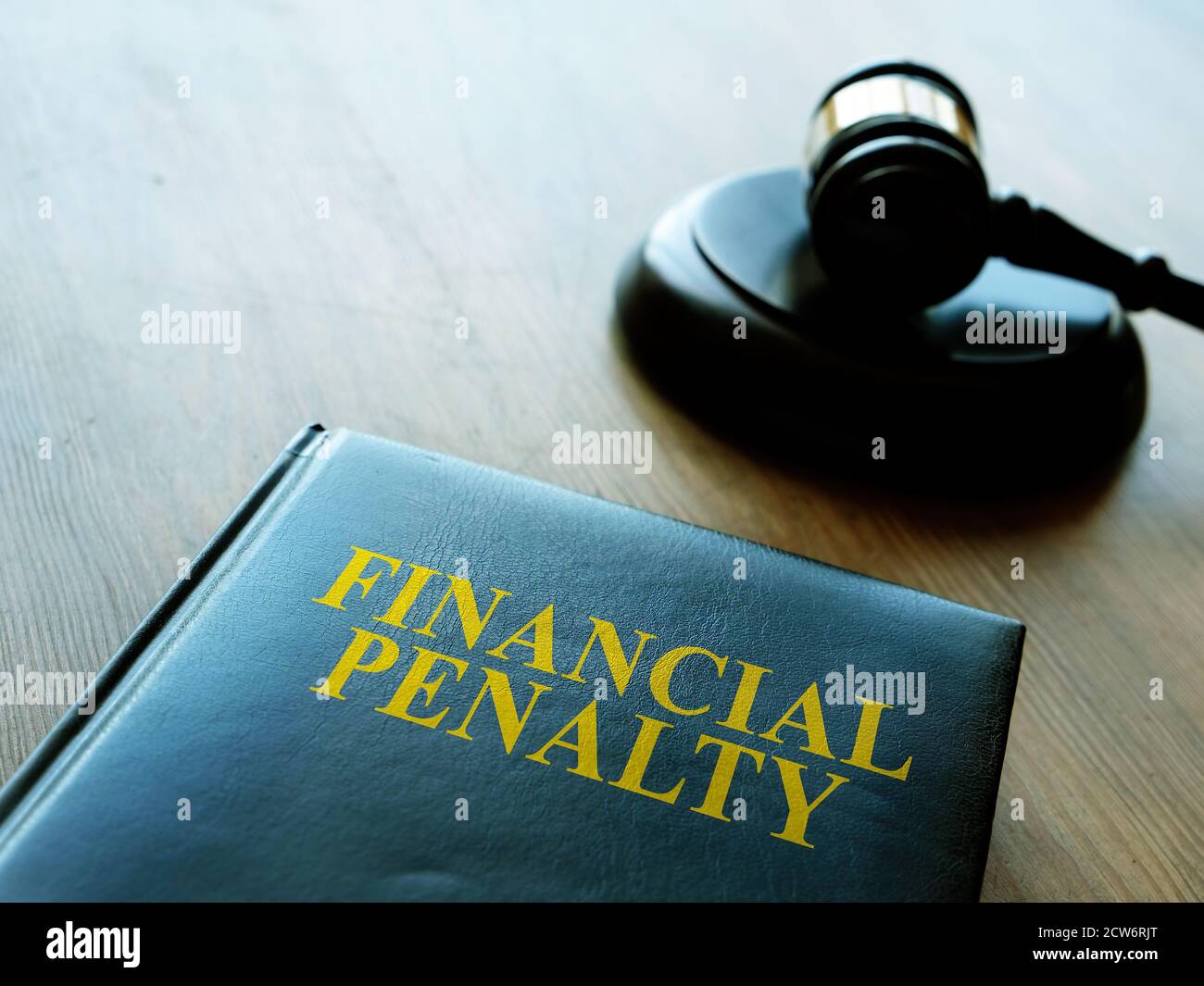 Financial penalty code book and wooden gavel. Stock Photo