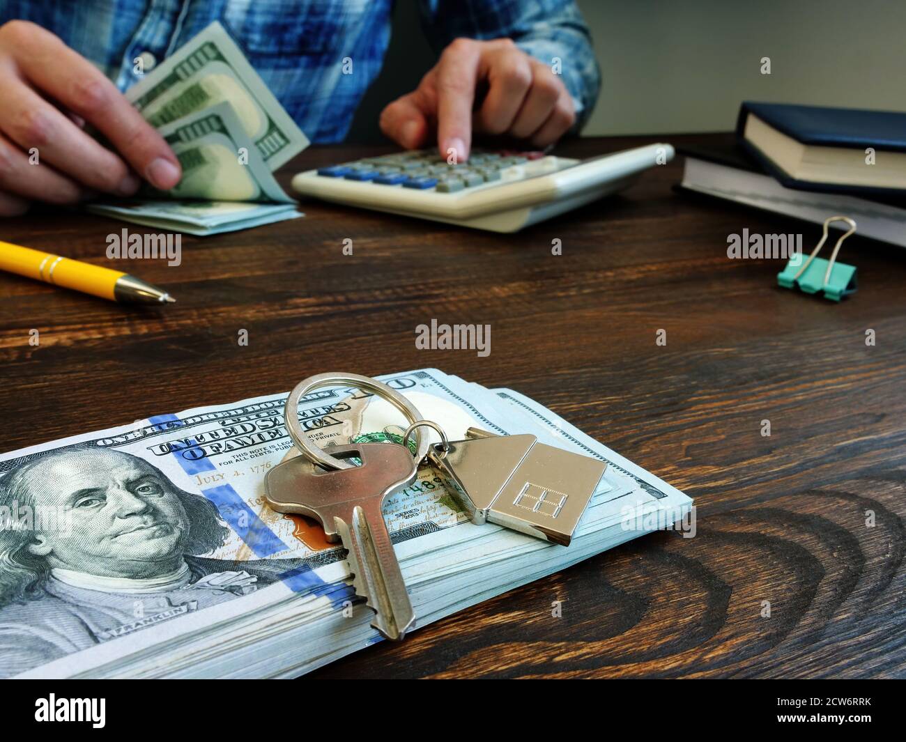 Money to buy real estate or mortgage. Key and dollars. Stock Photo