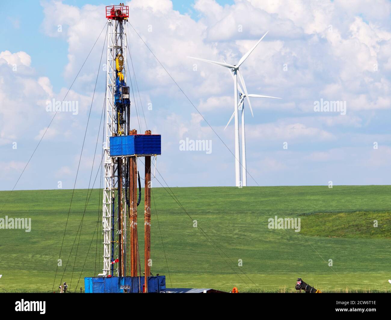 Oil and Gas drilling equipment with Wind turbine on background