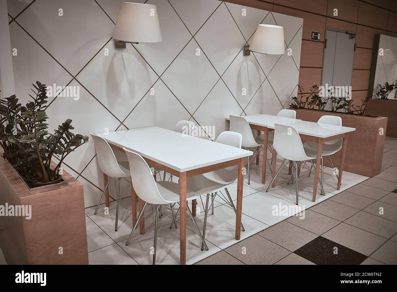 White stools and white tables at cafe Stock Photo