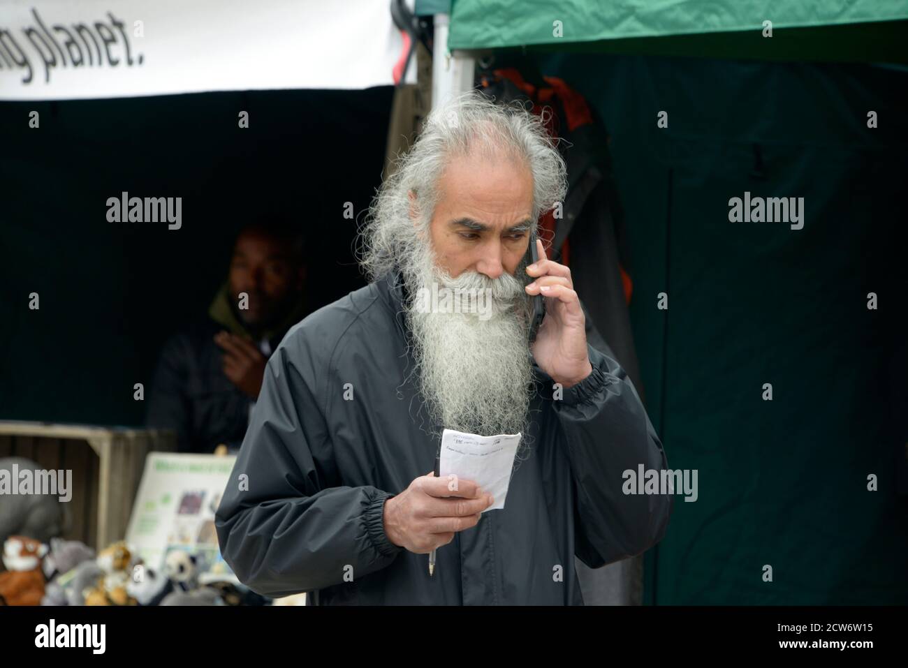 Grey Bearded old gent, on mobile phone. Stock Photo