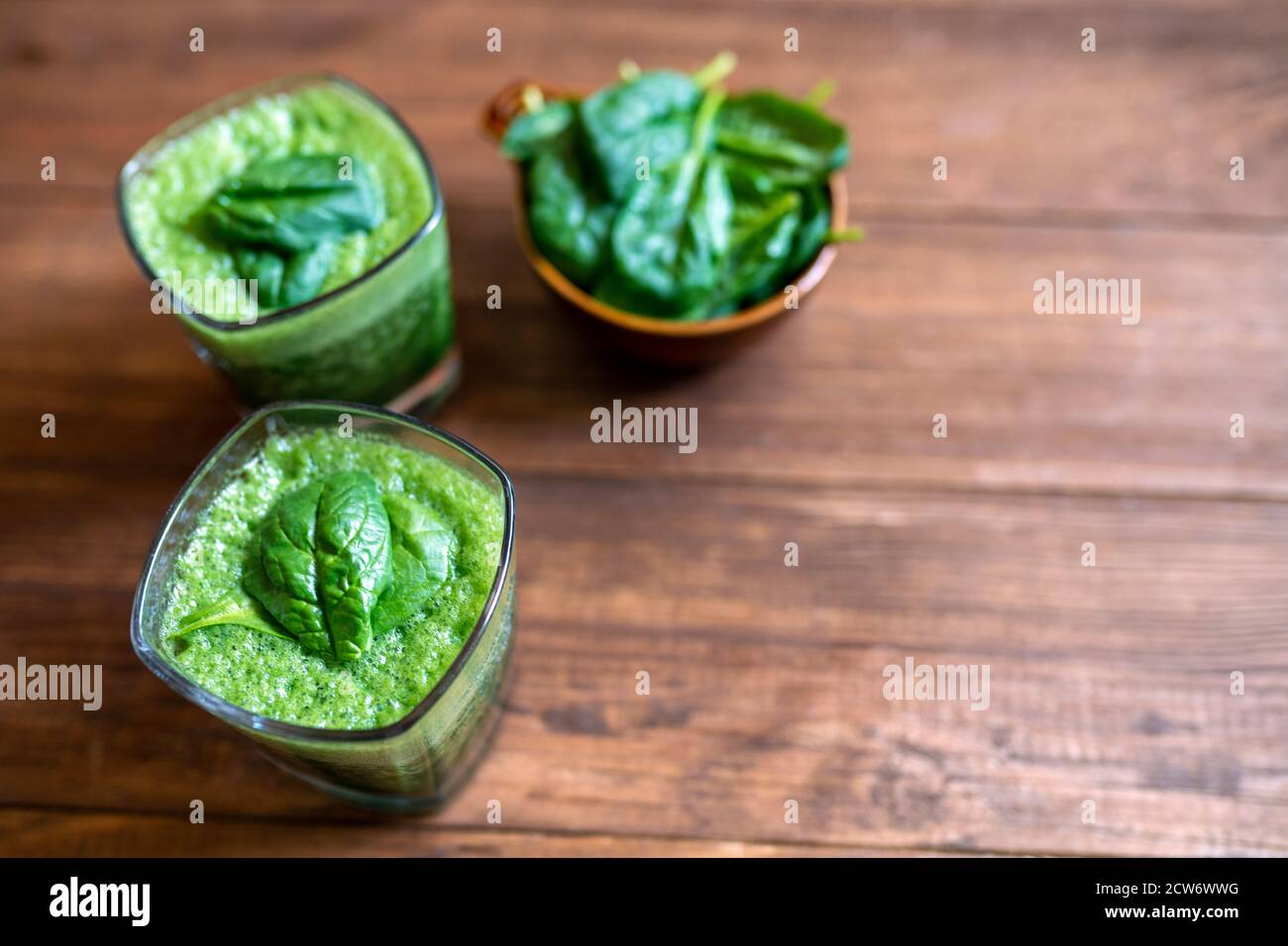 Spinach smoothie made with banana, baby spinach and spirulina powder