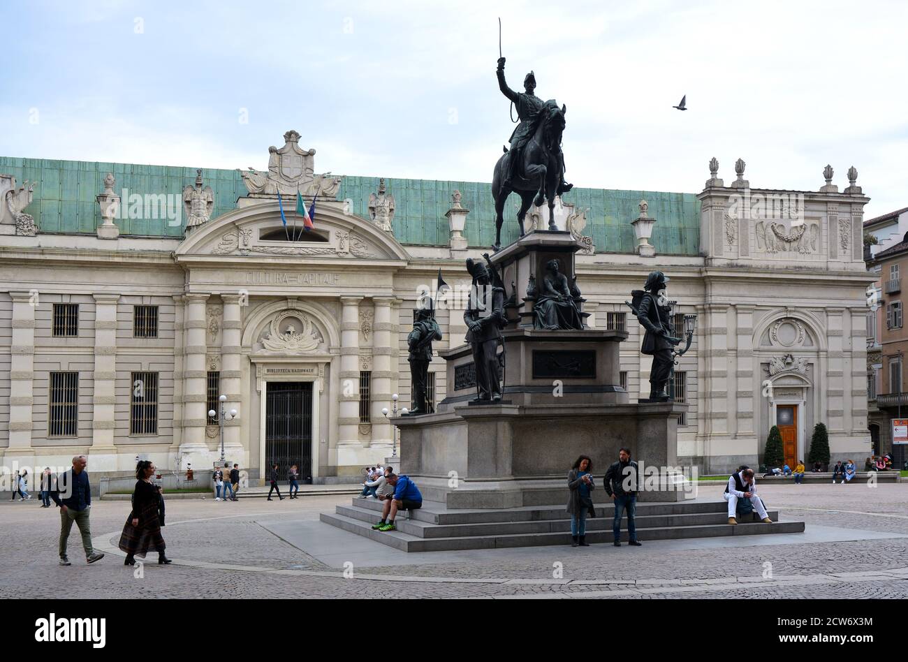Turin, Piedmont/Italy -04/20/2019- Turin the equestrian statue of Carlo Alberto of Savoy and the National Library on background. Stock Photo