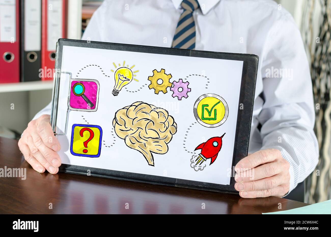 Problem solving concept shown by a businessman Stock Photo