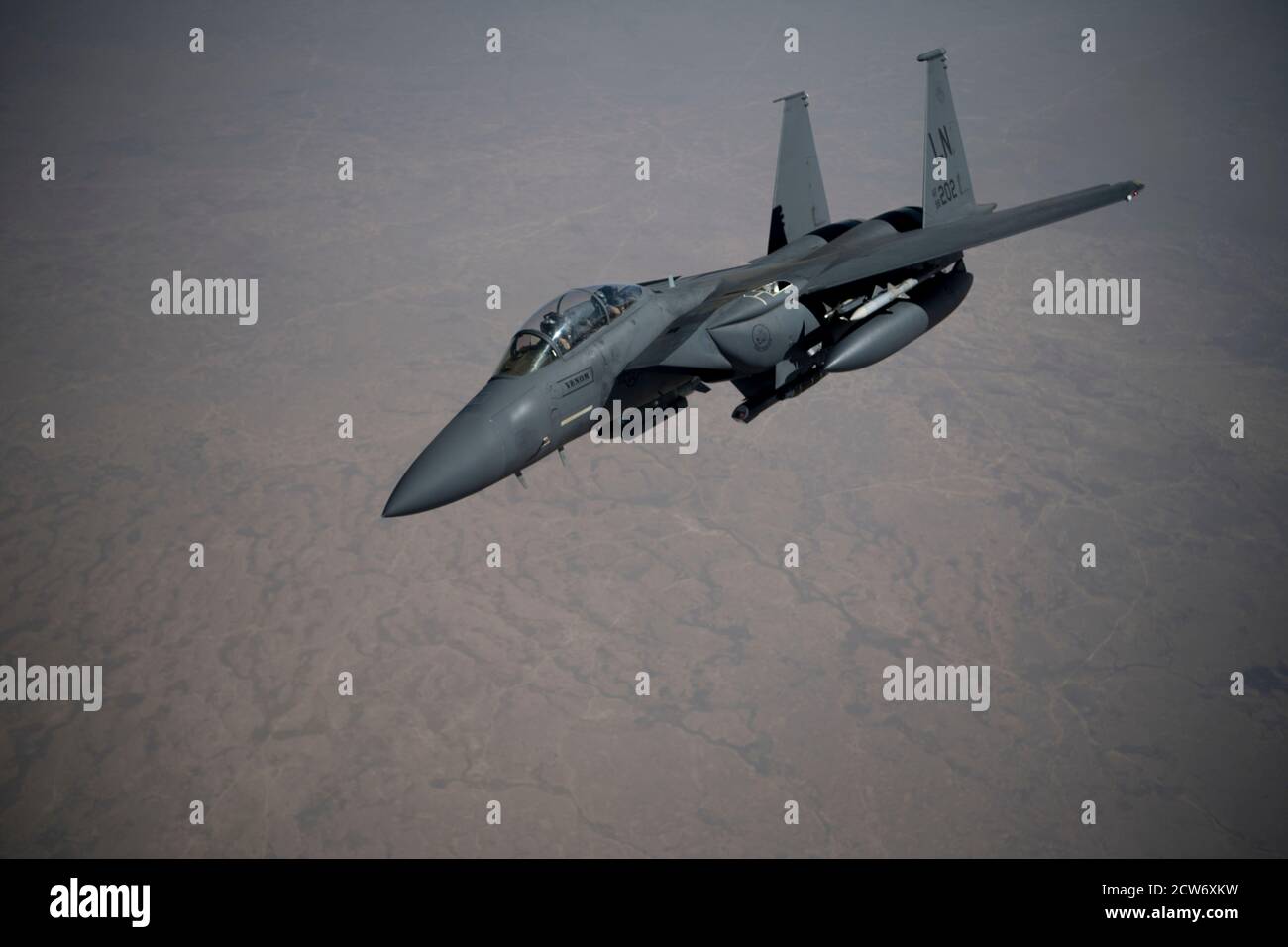 A U.S. Air Force F-15E Strike Eagle flies over the U.S. Central Command area of responsibility, Sept. 15th, 2020. The F-15E Strike Eagle is a dual-role fighter designed to perform air-to-air and air-to-ground missions, demonstrating U.S. Air Force Central Commands' posture to compete, deter and win against state and non-state actors. (U.S. Air Force photo by Staff Sgt. Jason Allred) Stock Photo