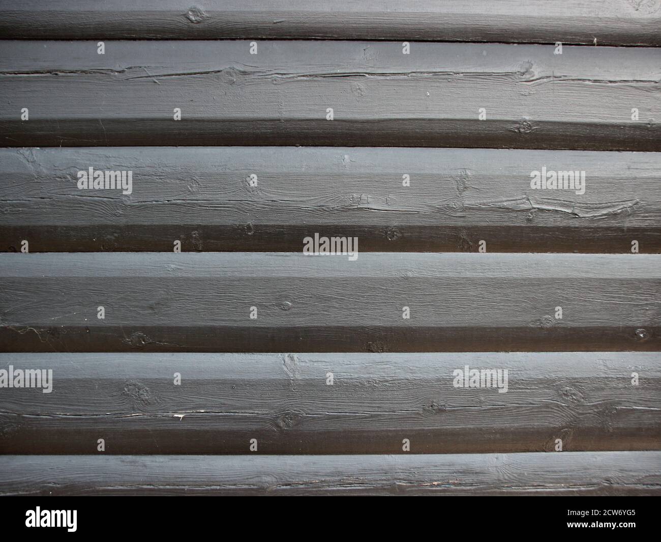A close view of the structure of a grey wooden fence. Symmetrical and a good background. Stock Photo