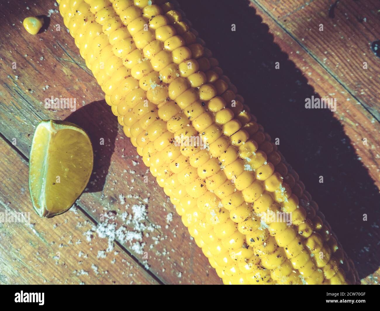 Sweet corn on the table with limes Stock Photo