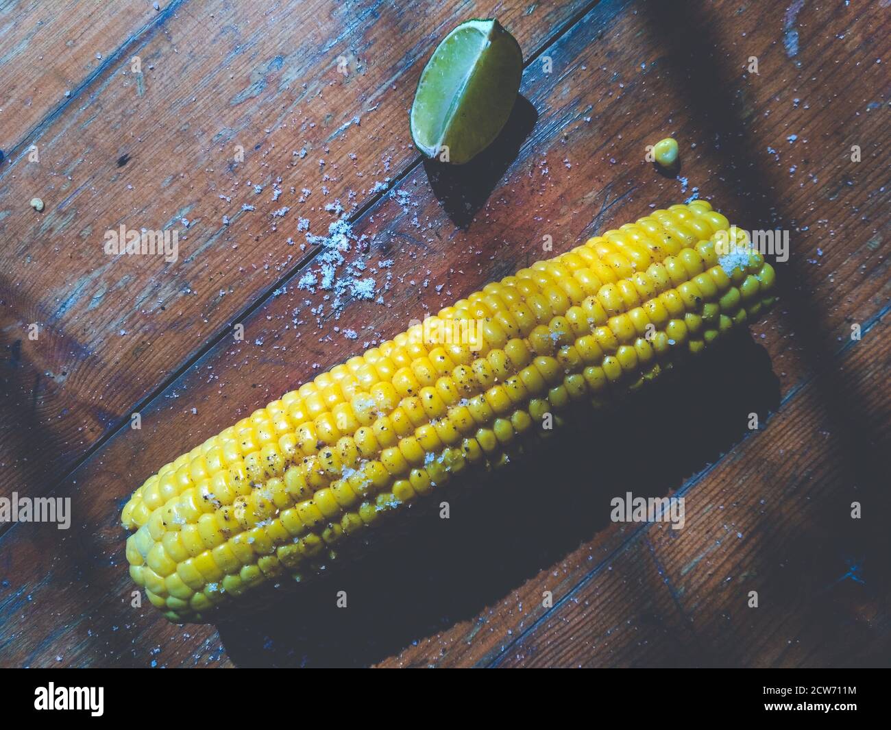 Sweet corn on the table with limes Stock Photo