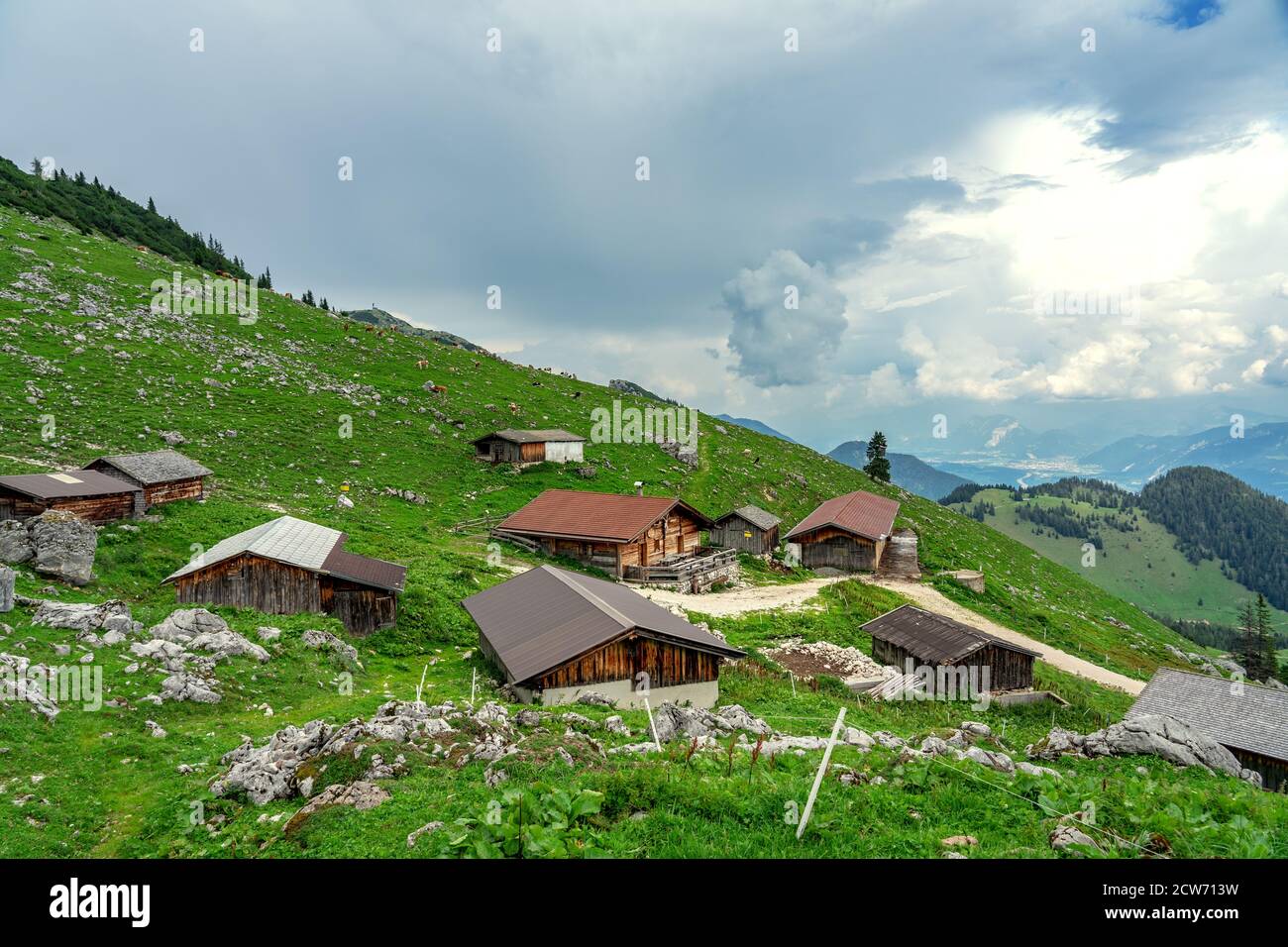 tyrol huts with mountains in the background Stock Photo - Alamy