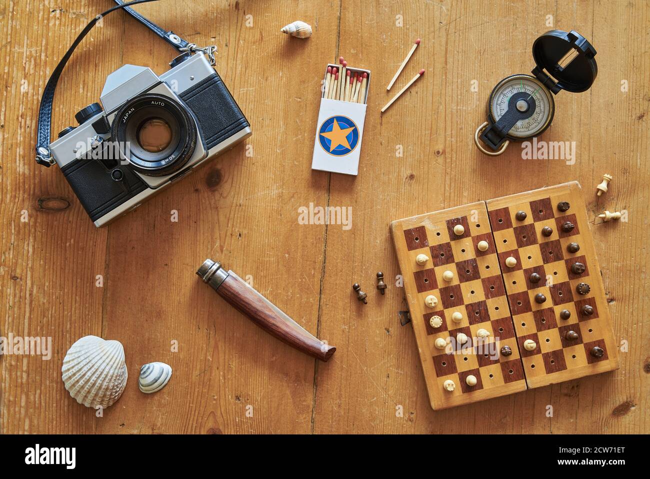 Topview of retro travel equipment on a wooden table. Vintage