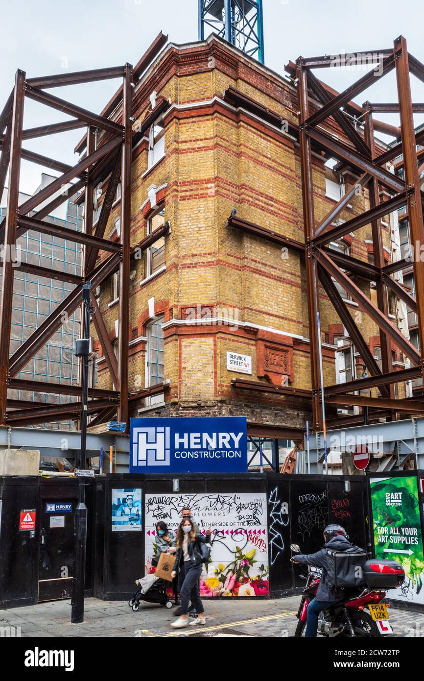 Facadism London - 1886 building facade of a former pharmacy being preserved at the junction of Berwick Street and Broadwick Street in Soho London Stock Photo