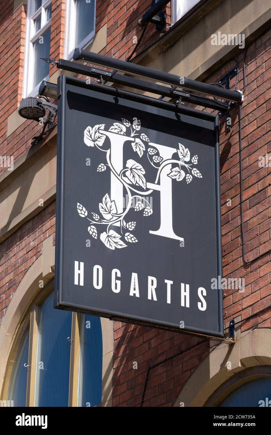 Sign for Hogarths public house in the town centre in Bolton Lancashire July 2020 Stock Photo