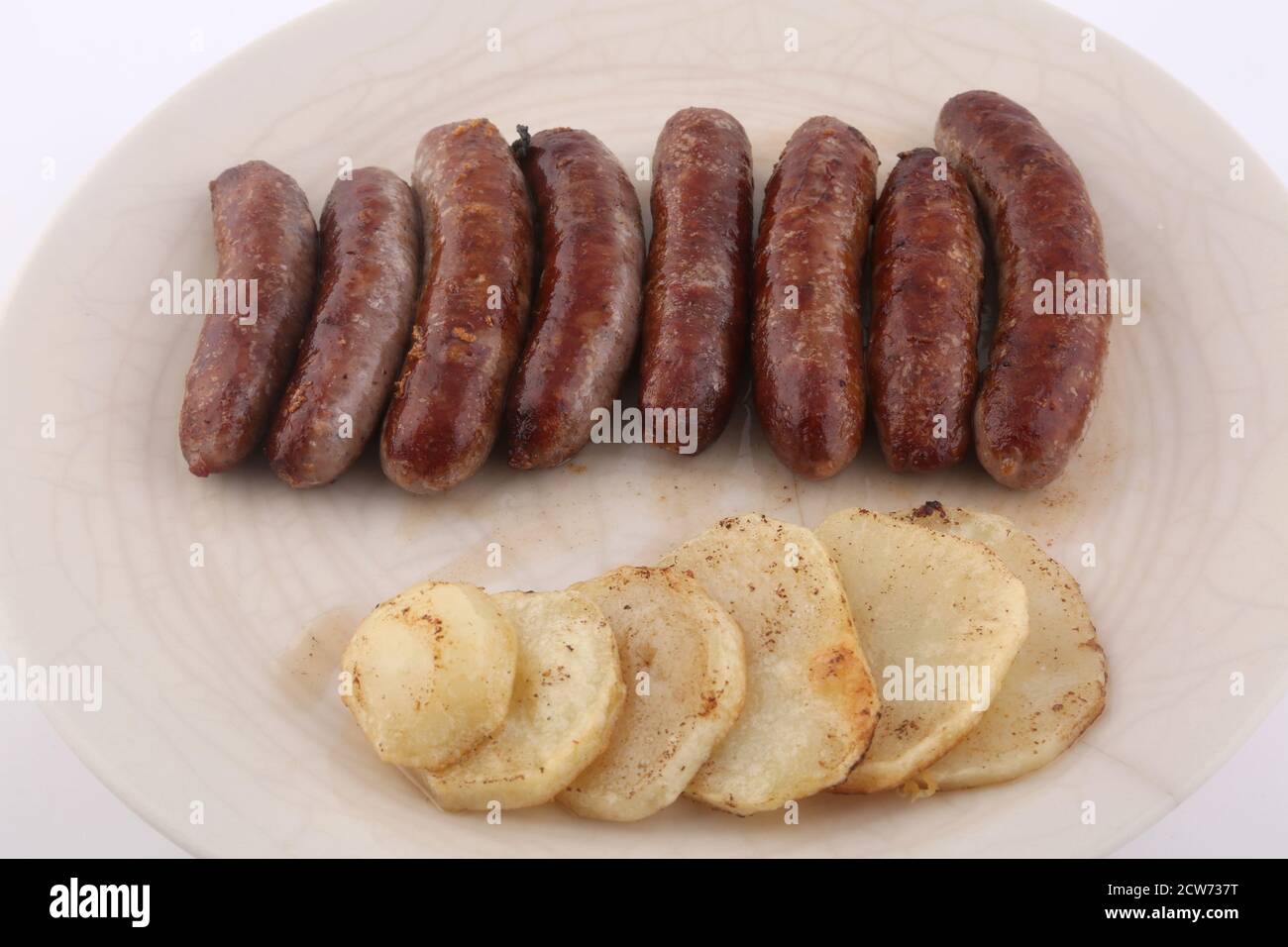 cooked pork sausages with potatoes side Stock Photo Alamy