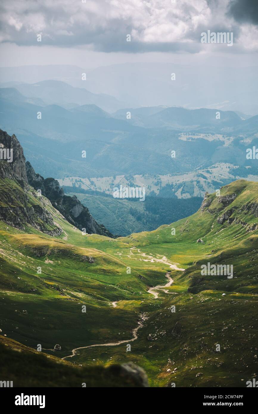 Carpathian mountains summer landscape at with green sunny hills, amazing  vintage retro hipster background. Bucegi,Romania,Transylvania Stock Photo -  Alamy