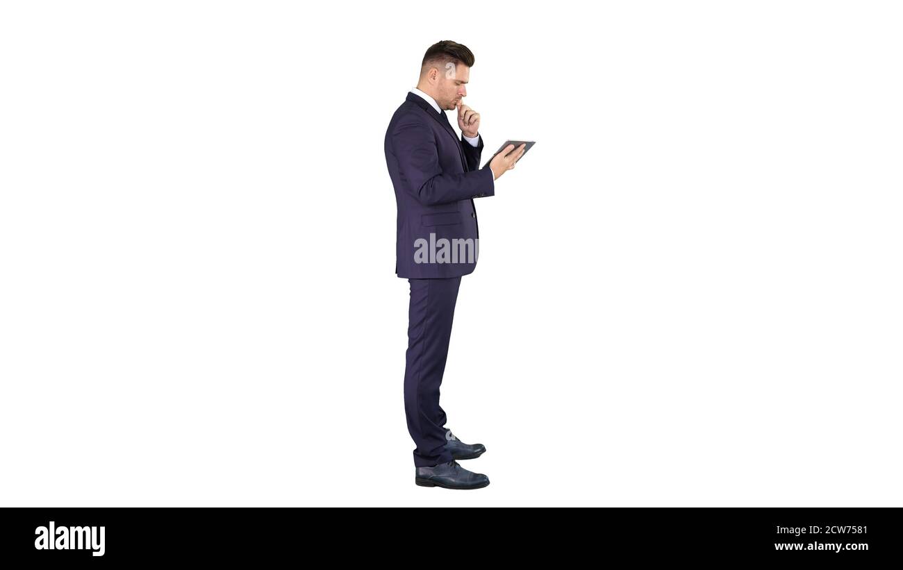 Smart senior businessman using a technology tablet on white back Stock Photo