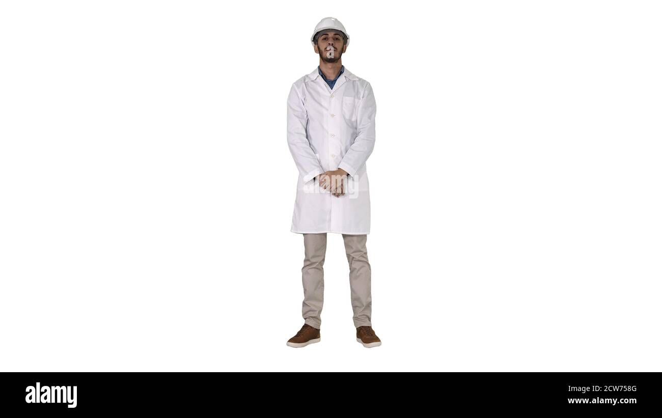 Arab engineer in white robe putting hard hat on Safety concept on white