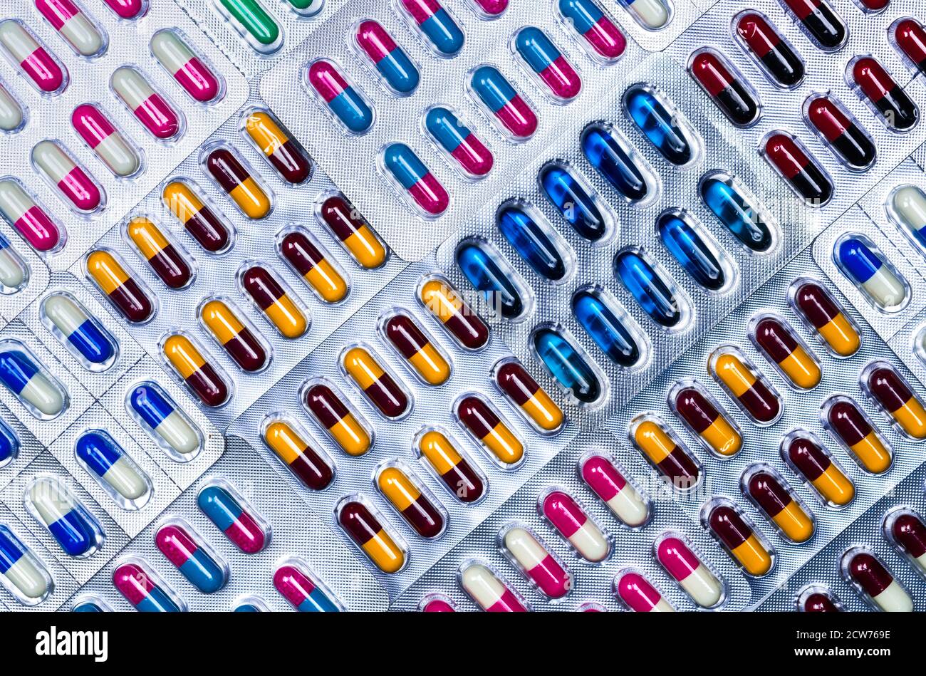 Top view of capsule pills in blister pack. Pharmaceutical industry. Pharmaceutical manufacturing industry concept. Capsule pills production. Stock Photo
