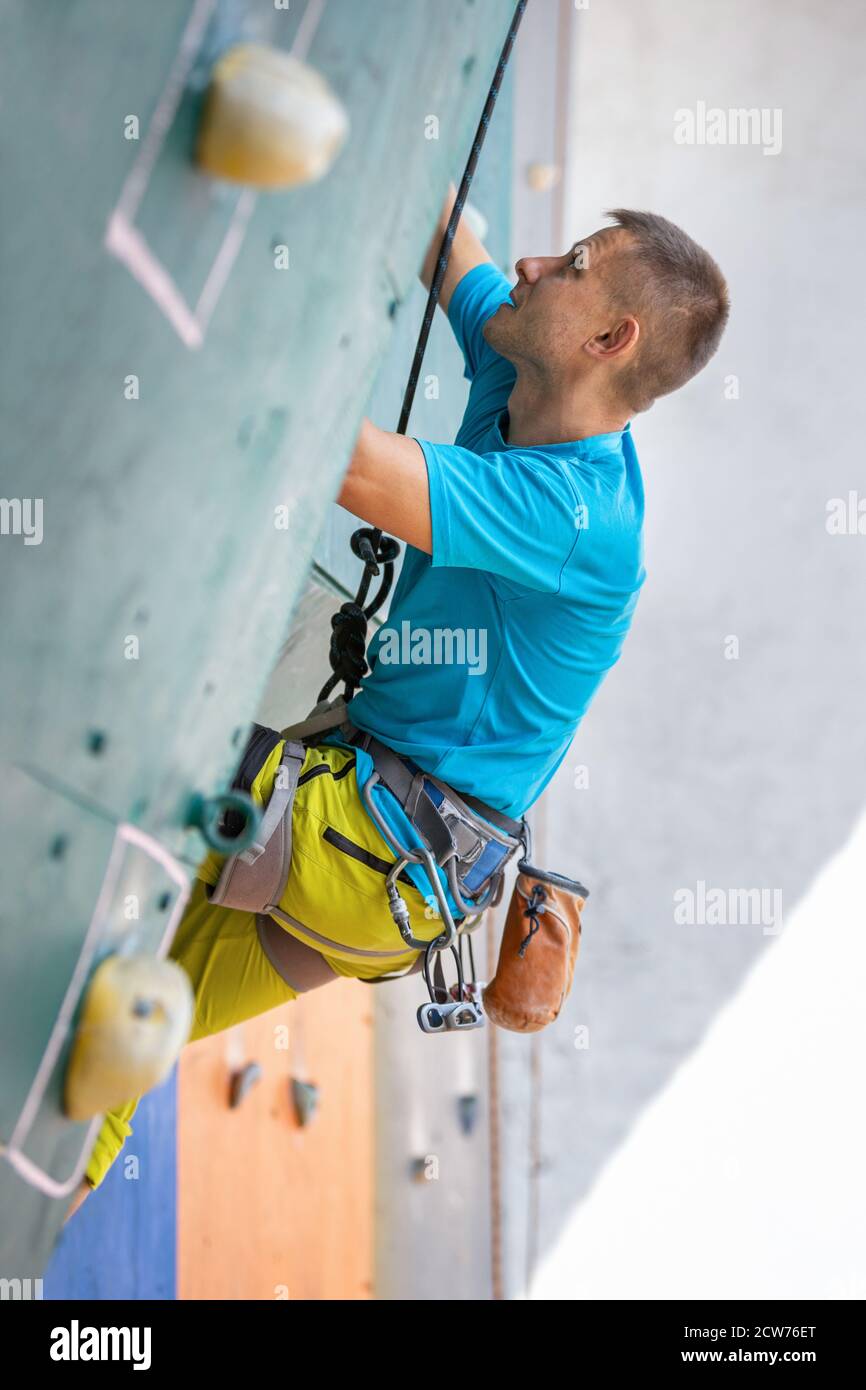 Man climbing indoor wall hi-res stock photography and images - Alamy