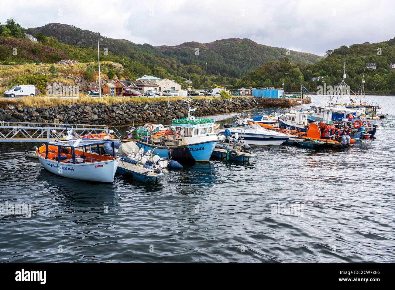 Fishing boats and tourist boats moored at Charlestown Harbour on Loch Gairloch, Wester Ross, Highland Region, Scotland, UK Stock Photo
