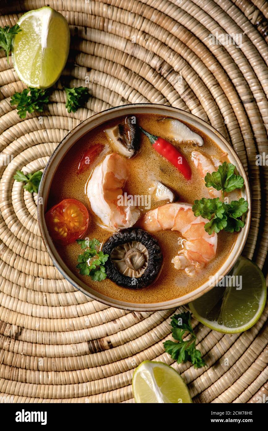 Traditional spicy Thai soup tom yum kung with shiitake mushrooms and
