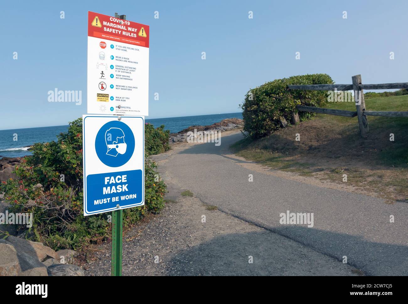Sign Requiring Face Mask to be Worn Along Marginal Way Scenic Trail in Ogunquit, Maine. Stock Photo