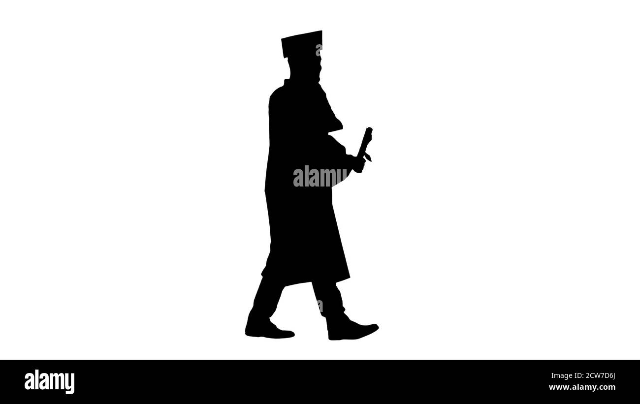 Graduating student walking and making a call, Alpha Channel Stock Photo