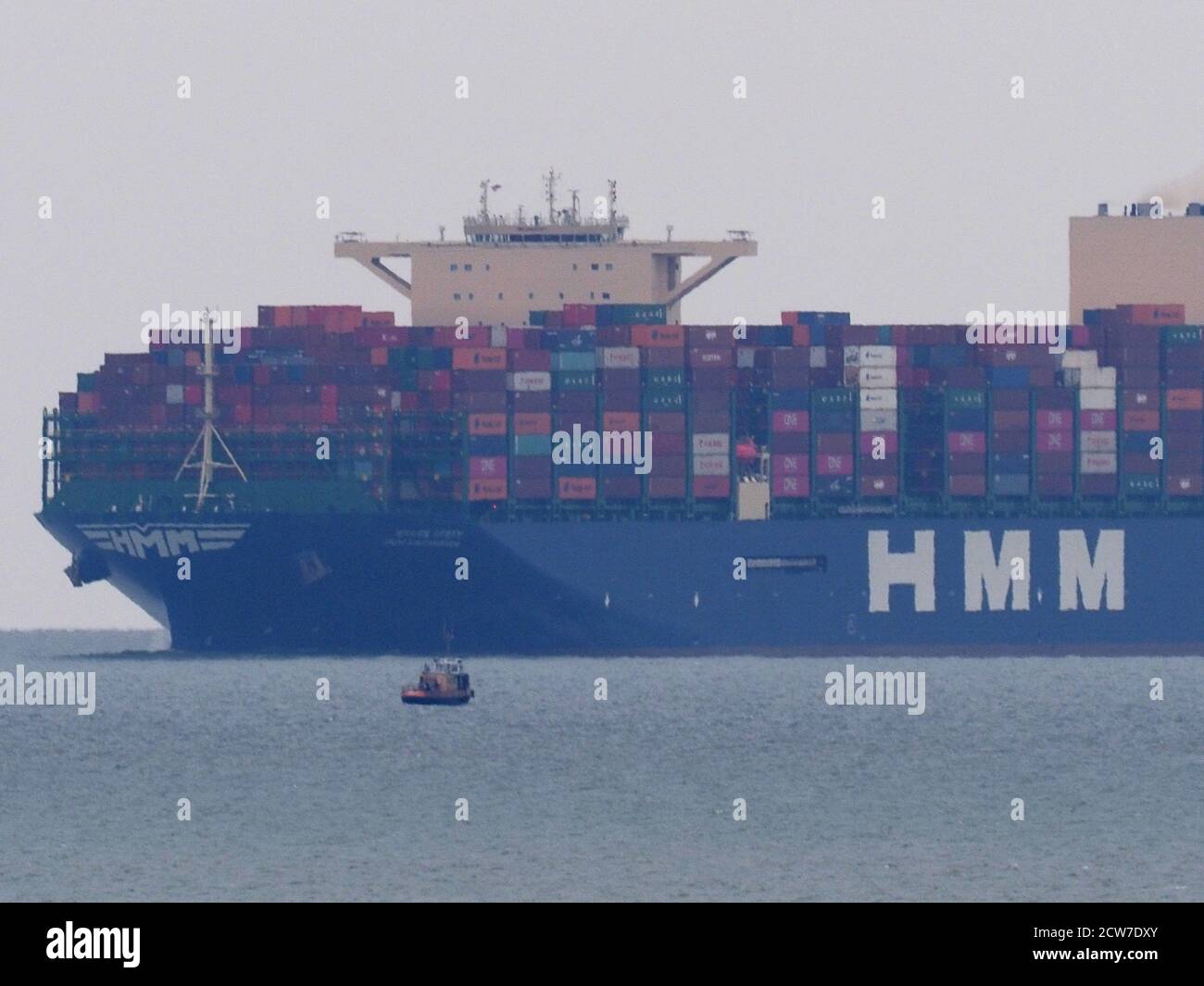 Warden, Kent, UK. 28th September, 2020. One of the world's largest container ships HMM Southampton seen passing the Red Sands Towers in the Thames Estuary from Warden, Kent at lunchtime. Credit: James Bell/Alamy Live News Stock Photo