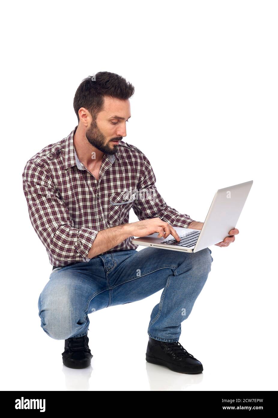 Carpenter working on laptop Stock Photo