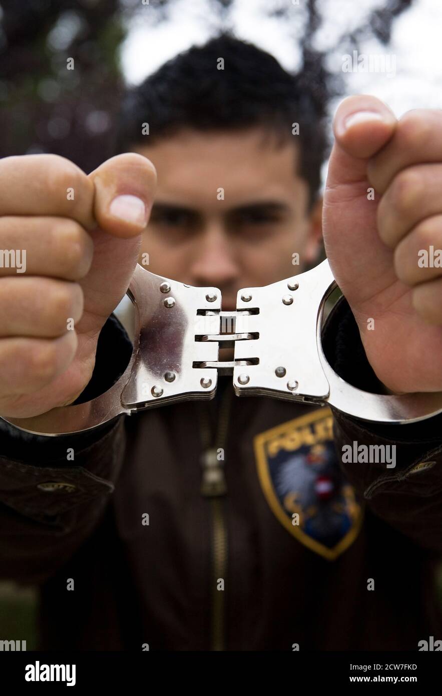 Cop with handcuffs Stock Photo Alamy