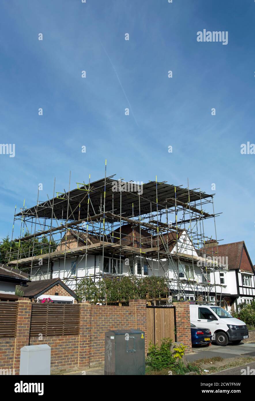 scaffolding over a 1920s house roof ahead of a loft conversion, in strawberry hill, twickenham, middlesex, england Stock Photo