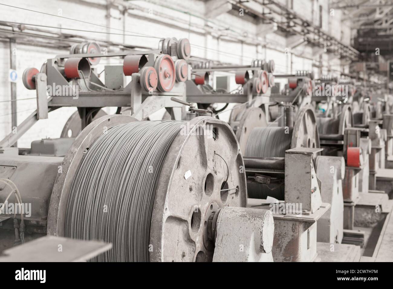 Wire rod, rebar, mesh in warehouses. production warehouse at the cable plant. Stock Photo