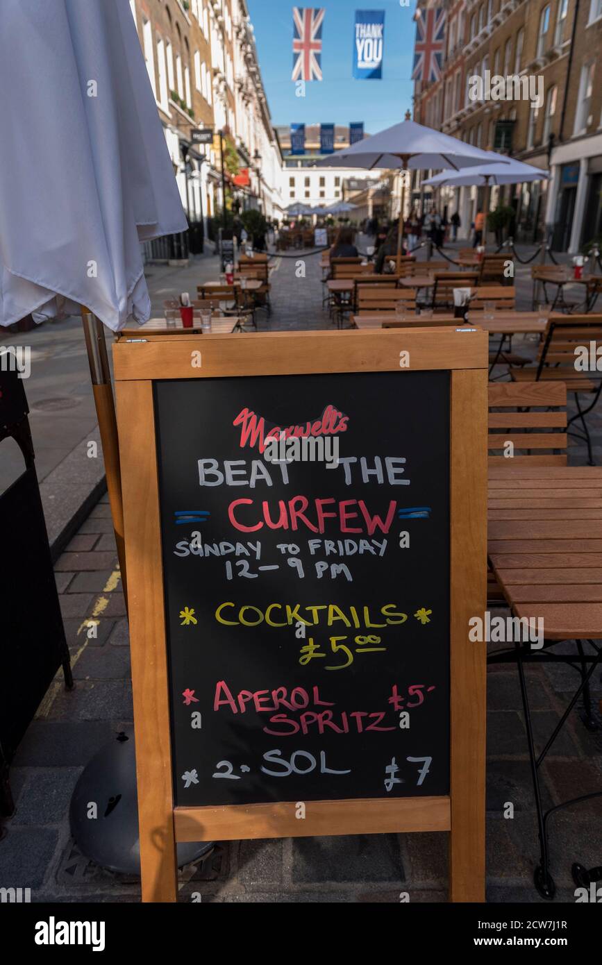 London, UK.  28 September 2020.  A sign outside a bar in Covent Garden designed to attract customers following the requirement for bars and pubs to close at 10pm as part of coronavirus lockdown restrictions imposed by the UK government.  Credit: Stephen Chung / Alamy Live News Stock Photo