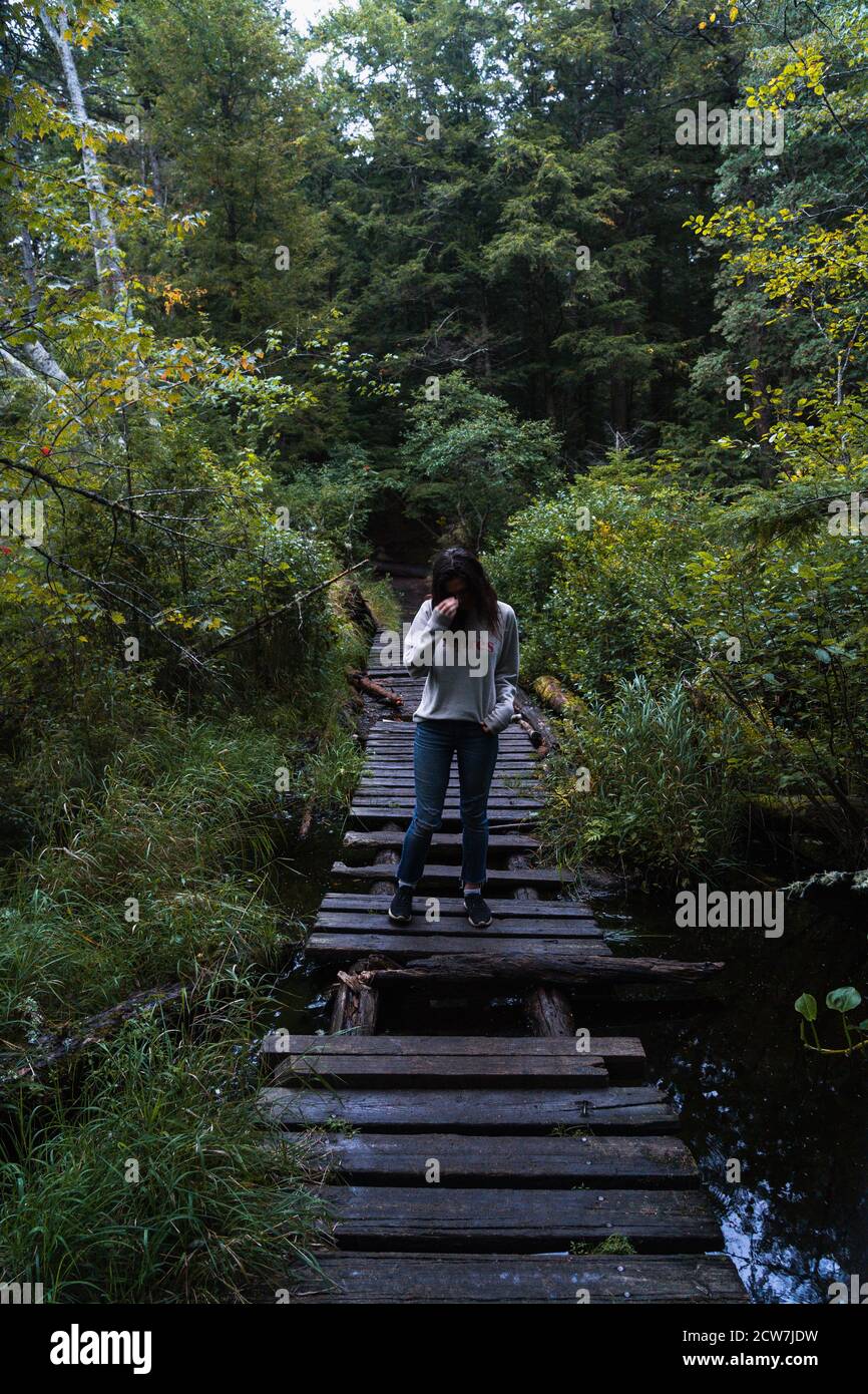A young woman on a hike in the rain in the Adirondacks Stock Photo - Alamy