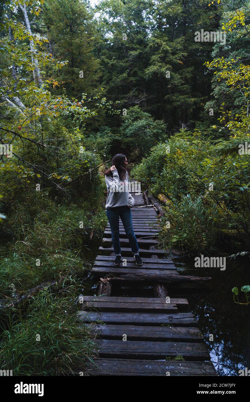 A young woman on a hike in the rain in the Adirondacks Stock Photo - Alamy