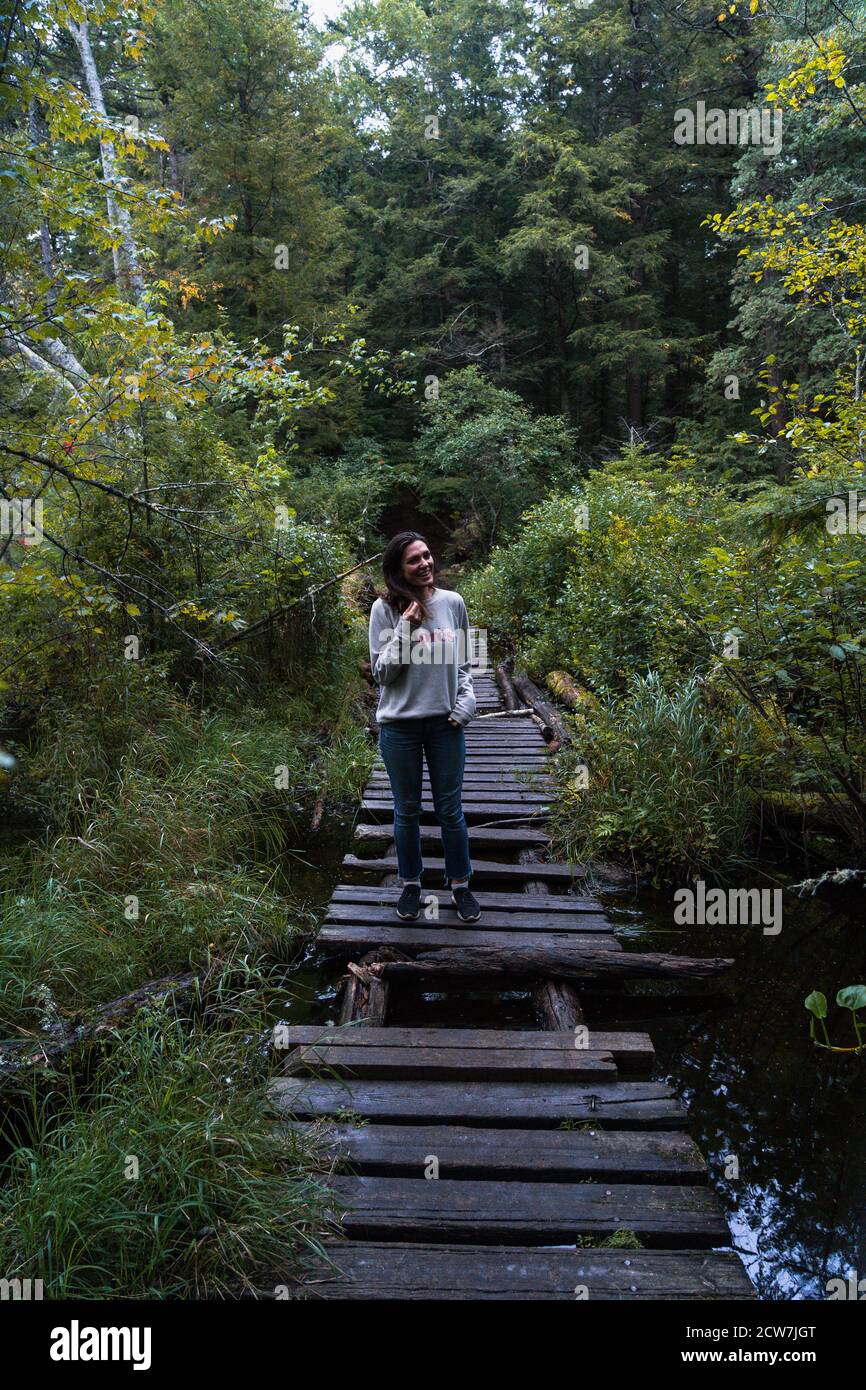A young woman on a hike in the rain in the Adirondacks Stock Photo - Alamy